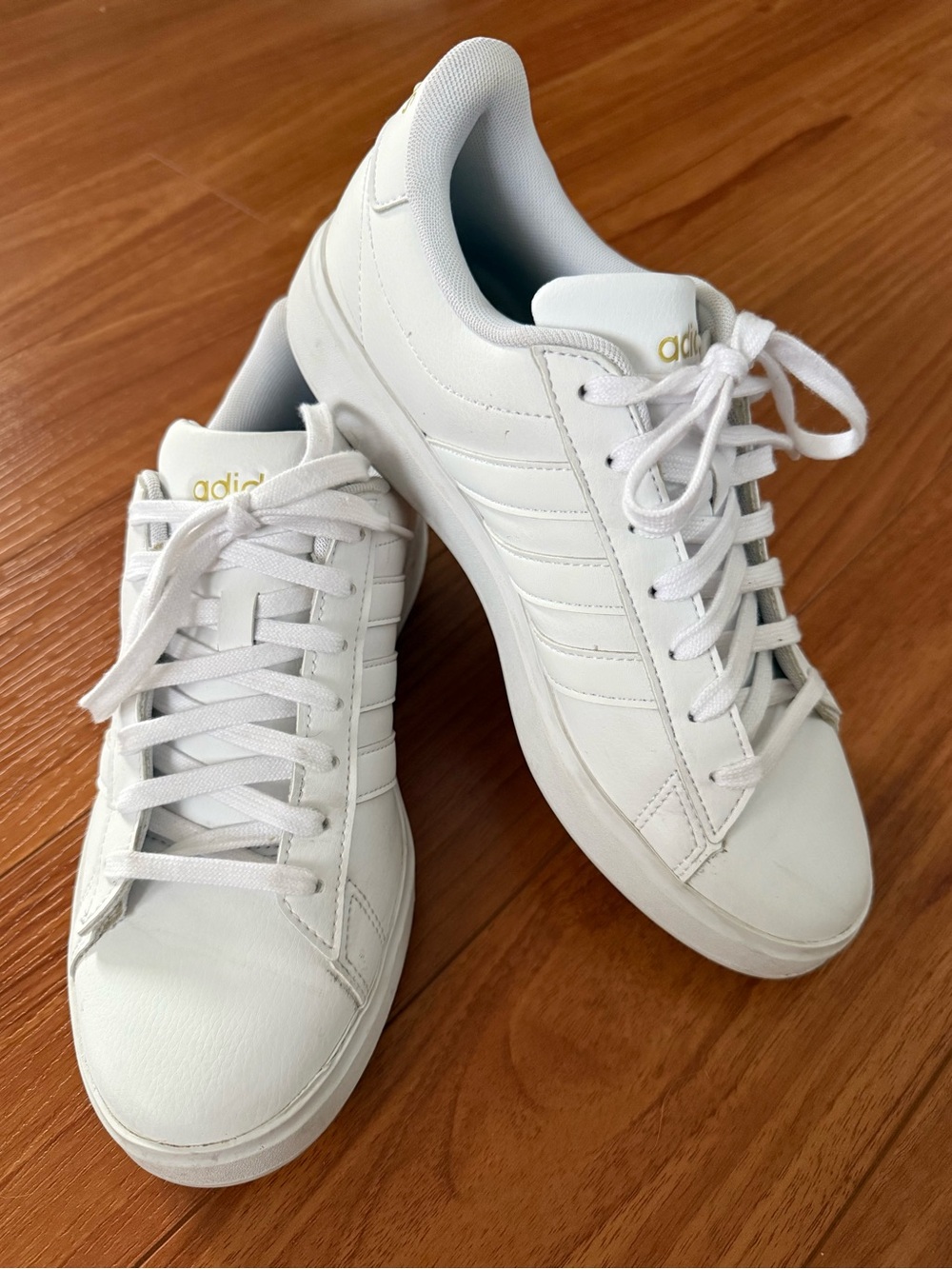 adidas Women’s White Low-Top Sneakers with Gold Logo
